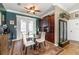 Charming dining area with French doors, built-in cabinets, and elegant décor at 3020 Crews Lake Dr, Lakeland, FL 33813