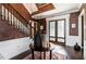 Elegant foyer showcasing decorative glass doors, dark hardwood floors, and staircase at 3020 Crews Lake Dr, Lakeland, FL 33813