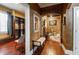 Elegant hallway with hardwood floors, decorative furniture, and an archway leading to another room at 3020 Crews Lake Dr, Lakeland, FL 33813