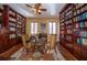 Spacious library with floor-to-ceiling bookshelves and a cozy reading nook at 3020 Crews Lake Dr, Lakeland, FL 33813