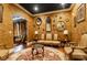 Elegant living room featuring gold walls, ornate mirrors, and hardwood floors, creating a luxurious and inviting atmosphere at 3020 Crews Lake Dr, Lakeland, FL 33813