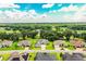 Picturesque community featuring mature trees, beautiful homes, and green surroundings from an aerial perspective at 3176 Pearly Dr, Lakeland, FL 33812