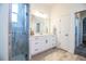 Bathroom featuring a glass shower, marble countertops, and modern fixtures at 3176 Pearly Dr, Lakeland, FL 33812