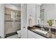 Bathroom with a glass enclosed shower, granite countertop and tile floors at 3176 Pearly Dr, Lakeland, FL 33812