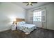 Comfortable bedroom with a large window, carpeted floors, and a cottage style decor at 3176 Pearly Dr, Lakeland, FL 33812
