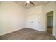 Neutral bedroom with carpet, fan and ample closet space near a bathroom and hallway at 3176 Pearly Dr, Lakeland, FL 33812