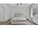 Neutral bedroom with soft carpet, tray ceiling, and large window allowing for ample natural light at 3176 Pearly Dr, Lakeland, FL 33812