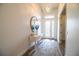 Bright entryway features wood floors, decor, and an ornate glass front door at 3176 Pearly Dr, Lakeland, FL 33812