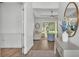 Bright entryway featuring hardwood floors, a console table, and a view to the living area at 3176 Pearly Dr, Lakeland, FL 33812