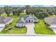 Stunning single-story home boasts lush landscaping and a brick-paved driveway in a serene neighborhood at 3176 Pearly Dr, Lakeland, FL 33812