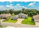 Charming single-story home with a well-manicured lawn and an inviting paver driveway at 3176 Pearly Dr, Lakeland, FL 33812