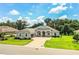 Inviting single-story home featuring a paver driveway, manicured lawn, and classic design elements at 3176 Pearly Dr, Lakeland, FL 33812