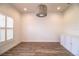 Bright flex room with plantation shutters, wood floors and decorative lighting fixture at 3176 Pearly Dr, Lakeland, FL 33812
