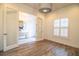 Light-filled flex room featuring wood floors and white plantation shutters at 3176 Pearly Dr, Lakeland, FL 33812