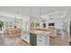 Bright kitchen with large island, stainless steel appliances, and open access to the dining and living areas at 3176 Pearly Dr, Lakeland, FL 33812