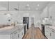 Spacious white kitchen with a large island, modern appliances, and hardwood floors at 3176 Pearly Dr, Lakeland, FL 33812