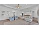 Bright living room with open floor plan, access to kitchen, and comfortable seating at 3176 Pearly Dr, Lakeland, FL 33812