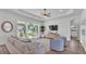 Bright living room with a ceiling fan, neutral decor, and a sliding glass door to the outside at 3176 Pearly Dr, Lakeland, FL 33812