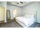 Bright main bedroom features a ceiling fan, neutral color palette, and doorway to ensuite bath at 3176 Pearly Dr, Lakeland, FL 33812