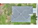 Aerial view of a well maintained roof with lush surrounding green landscaping at 3618 Highland Fairways Blvd, Lakeland, FL 33810