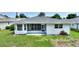 The lush backyard features a well-maintained lawn, tasteful landscaping, and a cozy screened-in porch at 3618 Highland Fairways Blvd, Lakeland, FL 33810