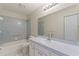 Bathroom featuring a single sink vanity and tub and shower combo at 3618 Highland Fairways Blvd, Lakeland, FL 33810