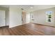 Spacious bedroom featuring wood-look floors, white walls and ensuite bathroom at 3618 Highland Fairways Blvd, Lakeland, FL 33810