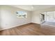 Bedroom with wood-look floors, white walls and sliding door to lanai at 3618 Highland Fairways Blvd, Lakeland, FL 33810