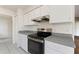 Modern kitchen featuring white cabinets, gray countertops, and stainless steel range at 3618 Highland Fairways Blvd, Lakeland, FL 33810