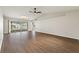 Spacious living room featuring sleek hardwood floors, vaulted ceilings and lots of natural light at 3618 Highland Fairways Blvd, Lakeland, FL 33810