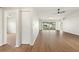 Bright living room boasting sleek flooring, neutral walls, and convenient access to other rooms at 3618 Highland Fairways Blvd, Lakeland, FL 33810