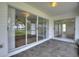 Screened patio with tile flooring and access to the home via sliding glass doors and water views at 3618 Highland Fairways Blvd, Lakeland, FL 33810