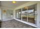 Enclosed patio with tile flooring and access to home via sliding glass doors at 3618 Highland Fairways Blvd, Lakeland, FL 33810