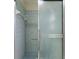 Shower stall features blue tile and sliding glass doors at 3618 Highland Fairways Blvd, Lakeland, FL 33810