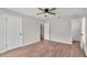 Bedroom featuring wood-look flooring and attached bathroom at 3829 Abbott Ln, Lakeland, FL 33810