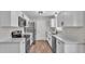 Updated kitchen with stainless appliances, white cabinets and quartz countertops at 3829 Abbott Ln, Lakeland, FL 33810