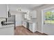 Renovated kitchen with white cabinets, stainless appliances, and wood-look flooring at 3829 Abbott Ln, Lakeland, FL 33810