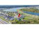 Stunning aerial view showcasing this home's location near a tranquil lake and well-maintained community amenities at 3883 Sandhill Crane Dr, Lakeland, FL 33811