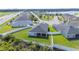Aerial view of a home with a screened lanai and a pristine, fenced backyard offering privacy and space at 3883 Sandhill Crane Dr, Lakeland, FL 33811