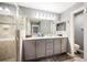 Bathroom features a double sink vanity, glass shower, and neutral color palette at 3883 Sandhill Crane Dr, Lakeland, FL 33811