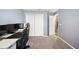 Bedroom includes carpet, a desk, and closet for storage and organization at 3883 Sandhill Crane Dr, Lakeland, FL 33811