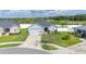 Aerial shot of a lovely single-Gathering home with a well-kept lawn, stone details, and a spacious driveway at 3883 Sandhill Crane Dr, Lakeland, FL 33811