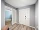 Welcoming foyer with neutral paint, a white front door, and an office nook through glass doors at 3883 Sandhill Crane Dr, Lakeland, FL 33811