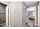 Hallway featuring wood-look floors and doorways leading to other rooms at 3883 Sandhill Crane Dr, Lakeland, FL 33811