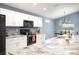 Granite counters and white cabinets offer an elegant cooking space at 3883 Sandhill Crane Dr, Lakeland, FL 33811