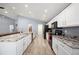 Bright kitchen featuring updated appliances, granite countertops, and ample cabinet space at 3883 Sandhill Crane Dr, Lakeland, FL 33811