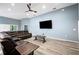 Bright living room featuring vaulted ceilings and modern entertainment setup at 3883 Sandhill Crane Dr, Lakeland, FL 33811