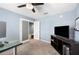 The office is carpeted and includes an entertainment center and double doors at 3883 Sandhill Crane Dr, Lakeland, FL 33811