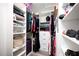 Organized walk-in closet with custom shelving, drawers, and ample space for clothing and accessories at 3883 Sandhill Crane Dr, Lakeland, FL 33811