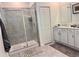 Modern bathroom with tiled shower, glass door, white cabinets, and sleek fixtures at 3966 Willowbrook Dr, Edgewater, FL 32141